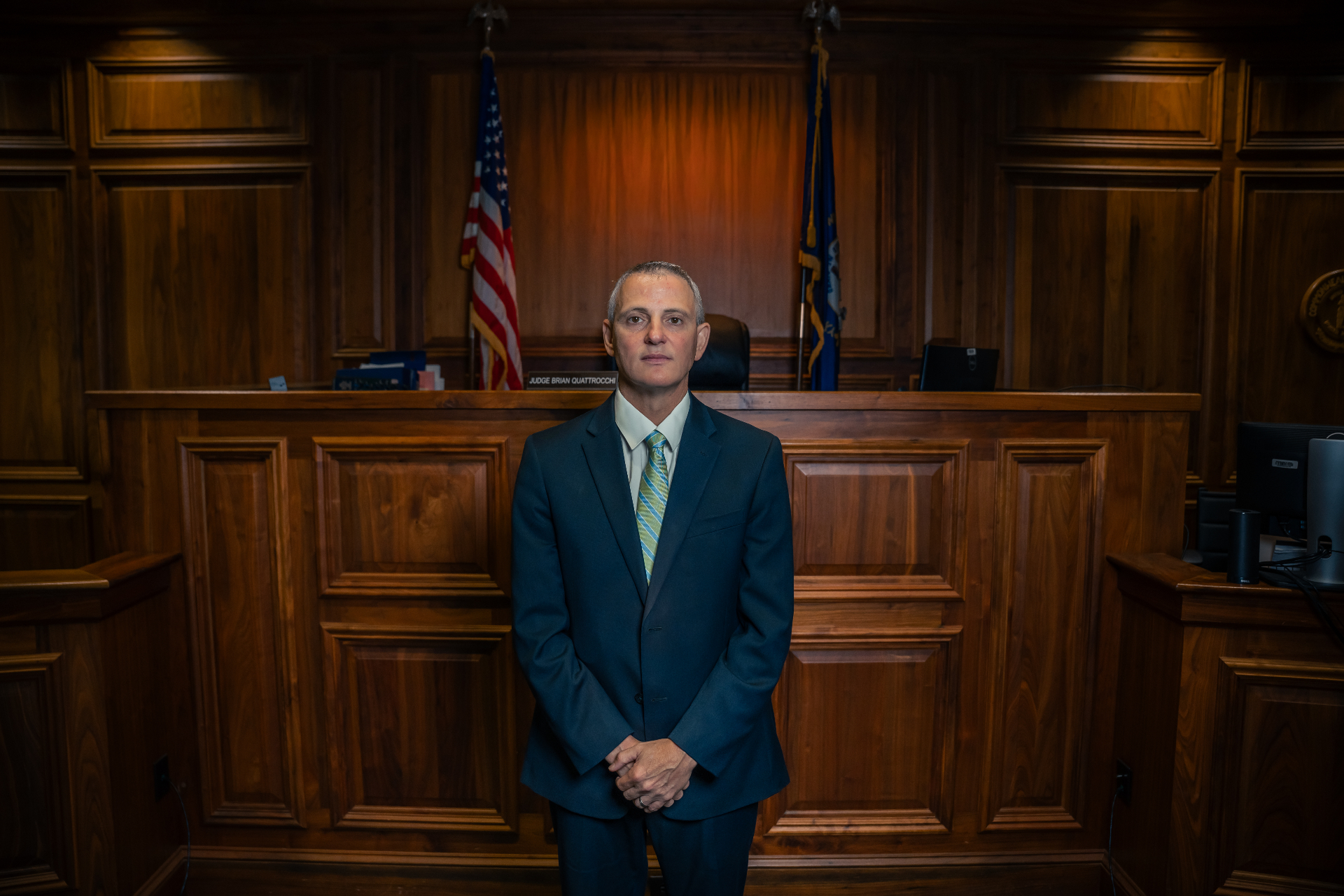 Judge Brian Quattrocchi standing in his courtroom